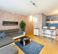 Living room in a 3-room apartment with a kitchenette and a sofa.
