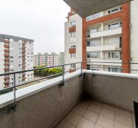 A balcony with a view of apartment buildings on Kaštieľska Street in Bratislava - Ružinov.