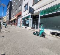 Electric scooters on Vysoká Street in the Old Town, Bratislava in front of commercial premises.
