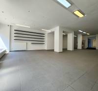 Spacious commercial spaces with large windows and modern lighting.