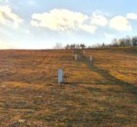 Hilly terrain with grass in the area of Župčany near Prešov, suitable for residential plots.