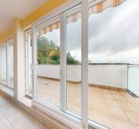 A bright room with a view of the terrace in a 3-room apartment.