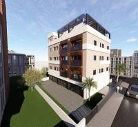 Residential complex in San Pedro del Pinatar with palm trees and parking in front of 3-bedroom apartments.