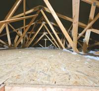 Attic of a family house with a wooden structure and insulation material.