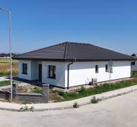 A family house in Hviezdoslavov on Jarná Street with a white facade and a gray roof.