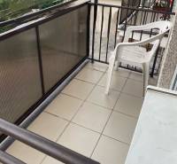 A balcony with a plastic chair in a 3-room apartment in Komárno.