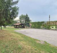 In Nová Polhora on Nová Polhora Street, the family house is surrounded by trees, a gazebo, and a grassy area.