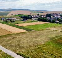 Aerial view of fields and houses in the village of Nová Pohora on Nová Pohora Street.