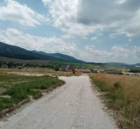 A stone path leads to the houses in Kunerad, residential plots surrounded by beautiful countryside.