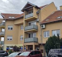 Apartment building on Kysucká Street in Senec with parking and balconies.