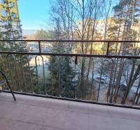 The balcony of a 2-room apartment with a view of greenery and Štúrova Street in Poprad.