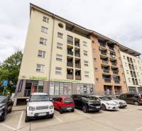 Apartment building on Betliarska Street in Bratislava, with a parking lot in front of the building.