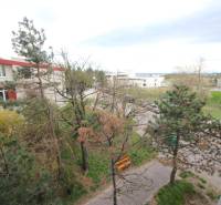 View from a 3-room apartment on Na Revíne Street in Bratislava - Kramáre, surrounded by greenery.