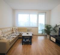 Living room in a 3-room apartment with a corner sofa and a television.