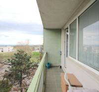 A balcony on a 3-room apartment with a view of greenery in Bratislava on Na Revíne street.
