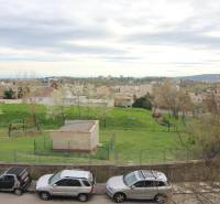 View of the playground and greenery from a 3-room apartment on Na Revíne Street in Bratislava.