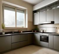Gray kitchen with a window, sink, and built-in ovens in a 3-room apartment.