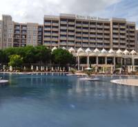 The exterior of a holiday apartment on the Sunny Beach with an interesting pool area.