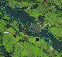 Satellite map of Rudník with agricultural and forest lands, color-coded parcels.