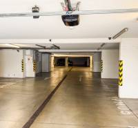 Underground garage with parking spaces and direction signs in Bratislava - Rača on Hečkova.