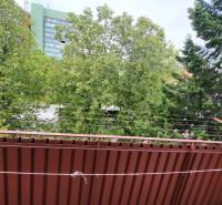The view from the balcony of a 3-room apartment on Joliot Curie Street in Poprad, full of trees.