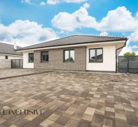 A family house in Dunajská Streda in Veľký Blahovo with a spacious paved yard and a fence.