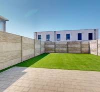 The courtyard of the family house on Obchodná Street in Hviezdoslavov with artificial grass and paving.