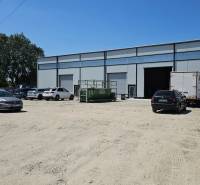 Commercial premises on Domové role Street in Bratislava - Ružinov. Several cars parked.