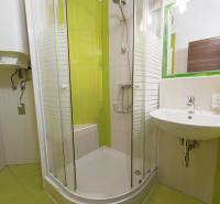 Renovated bathroom in a 2-room apartment with a bathtub, shower, and sink.