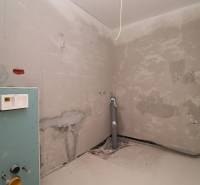 The stage of bathroom reconstruction in the Recreational Apartment with visible installation elements.