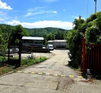 An industrial area in Banská Bystrica surrounded by greenery, typical for warehouses and halls.