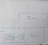 Floor plan of a 2-room apartment with a kitchen, bathroom, pantry, and balcony.
