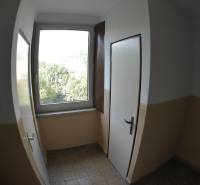 Stairwell with a window and doors in an apartment building in Bratislava - Petržalka.