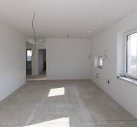 An empty room in a family house with multiple cables and an open window.