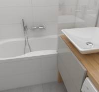 Bathroom in a 2-room apartment with a bathtub, sink, and wooden countertop.