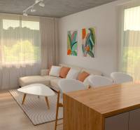 Living room in a 2-room apartment with a sofa, wooden table, and decorative paintings on the wall.
