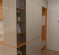 A kitchen with a kitchen unit and open shelves in a 2-room apartment.
