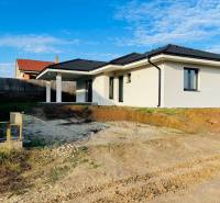 A newly built family house in Kynek, Nitra with simple architecture and a white facade.