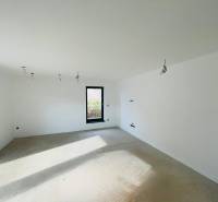 Windows and an empty room with white walls in a family house.