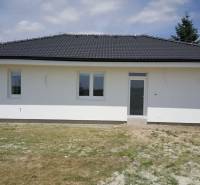 A family house in Western Slovakia with a gable roof and a white facade.