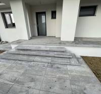 Entrance steps with gray tiles in a family house in Western Slovakia.