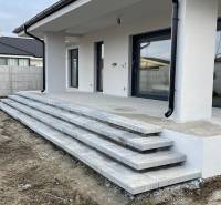 Family house in Western Slovakia with a concrete terrace and stairs, ready for completion.