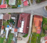 Aerial view of streets and buildings in Moravany nad Váhom, including dining spaces.