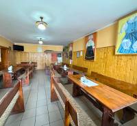 Traditional interior with wooden tables and chairs, decorations in dining areas.