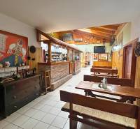 Rustic gastro spaces with wooden furniture and decorations create a cozy atmosphere.