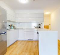 A kitchen with built-in cabinets and a refrigerator in a 5 or more room apartment.
