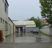 Buildings with warehouses and halls in Bratislava - Rača on a rainy day.