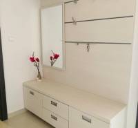 Light furniture, mirror, and drawers in a 2-room apartment on Palisády Street.