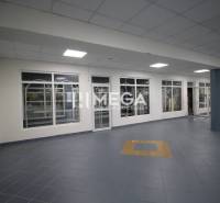 Commercial premises with tiled floors and glass walls.