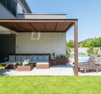 The terrace of a family house in Kvetoslavov with comfortable seating and loungers by the pool.